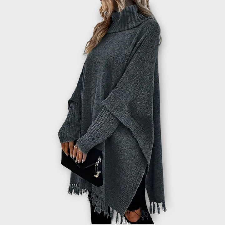 Poncho Maglione Oversized con Collo Alto e Frange