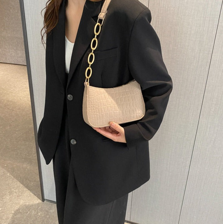 Magnella | Borsa a spalla elegante con design in rilievo coccodrillo