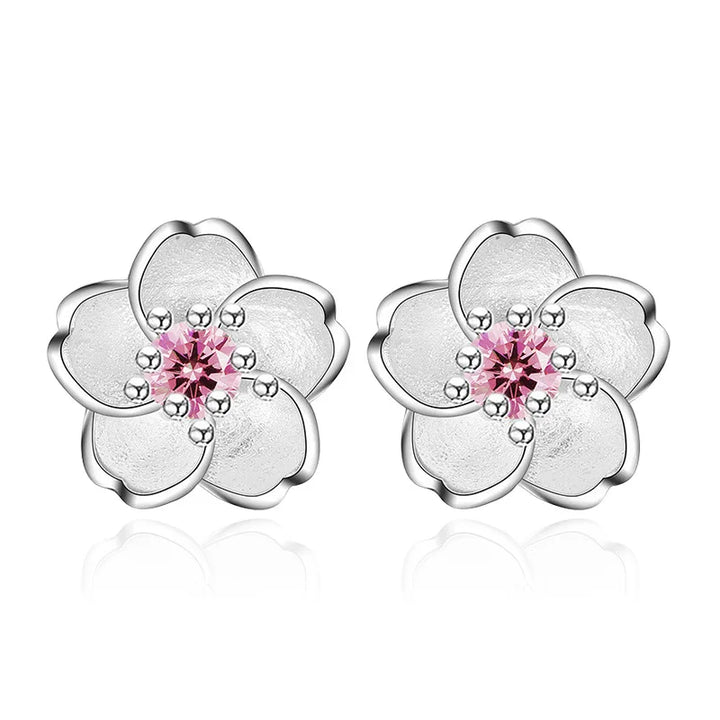 Orecchini a bottone con zirconia floreale