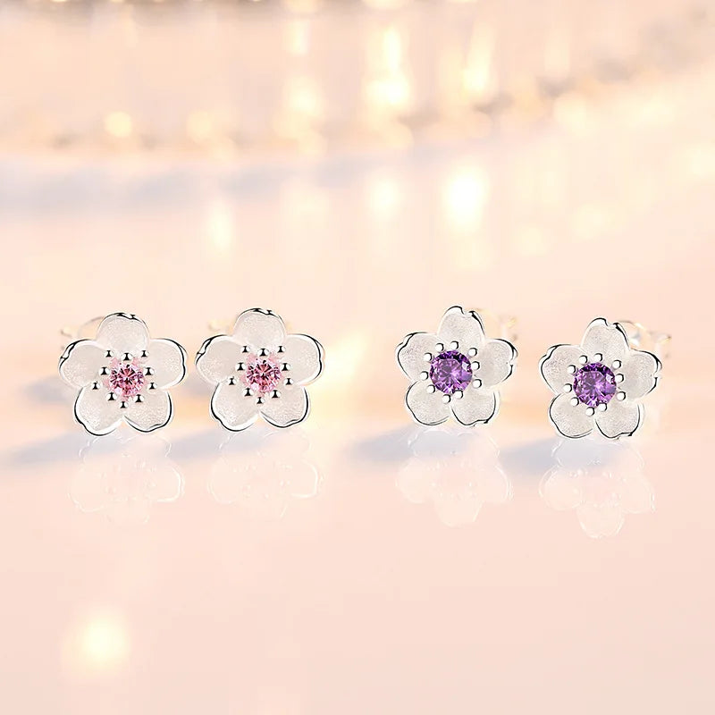 Orecchini a bottone con zirconia floreale