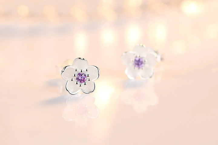 Orecchini a bottone con zirconia floreale