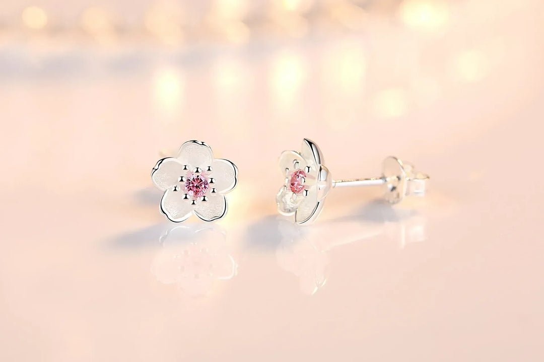 Orecchini a bottone con zirconia floreale