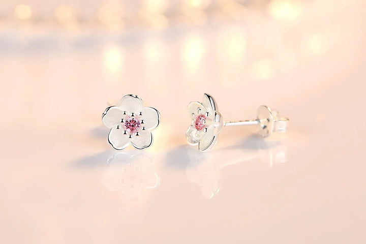 Orecchini a bottone con zirconia floreale