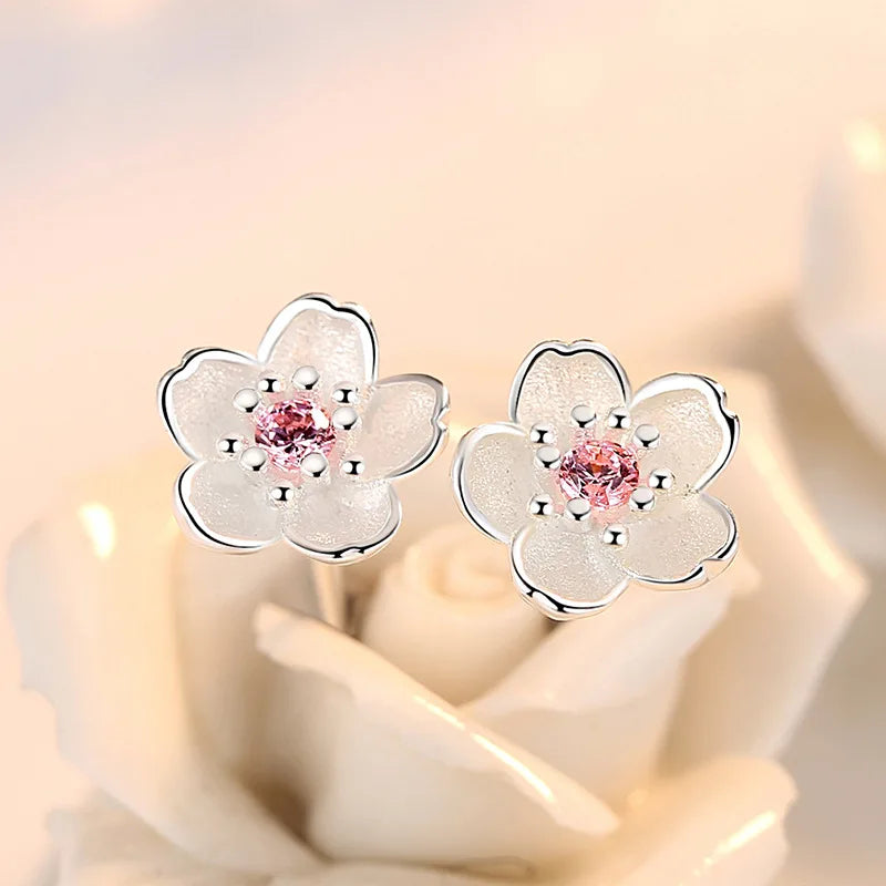 Orecchini a bottone con zirconia floreale