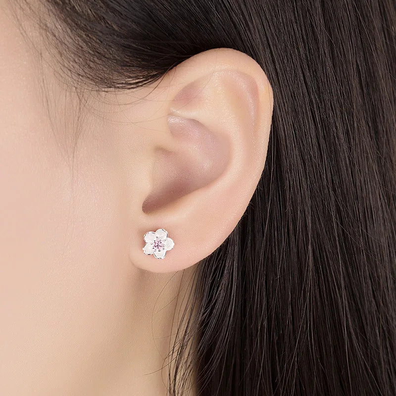 Orecchini a bottone con zirconia floreale