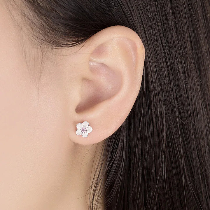 Orecchini a bottone con zirconia floreale