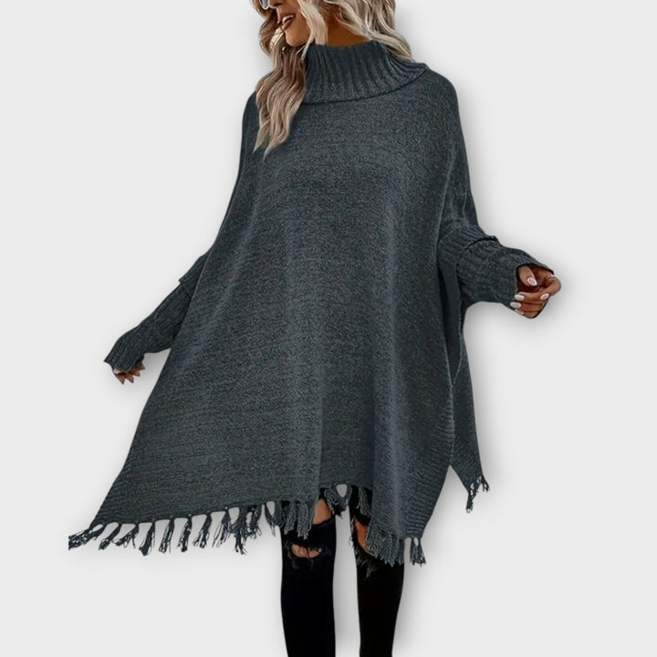 Poncho Maglione Oversized con Collo Alto e Frange