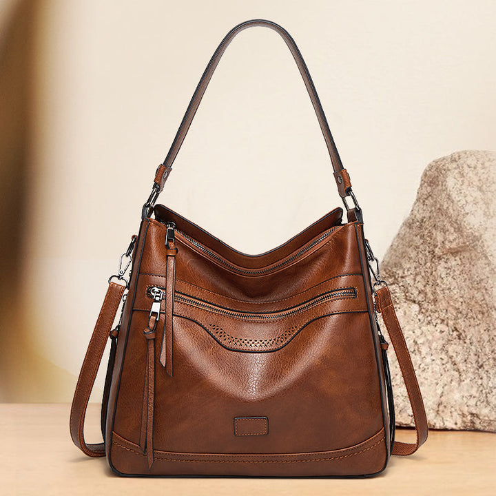 Malbjørg | Borsa a spalla elegante con design ondulato