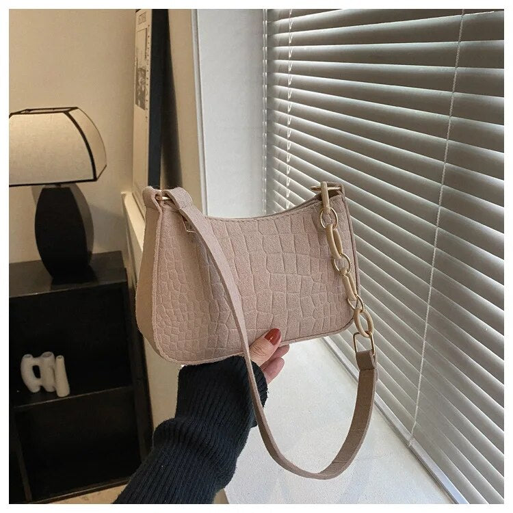 Magnella | Borsa a spalla elegante con design in rilievo coccodrillo